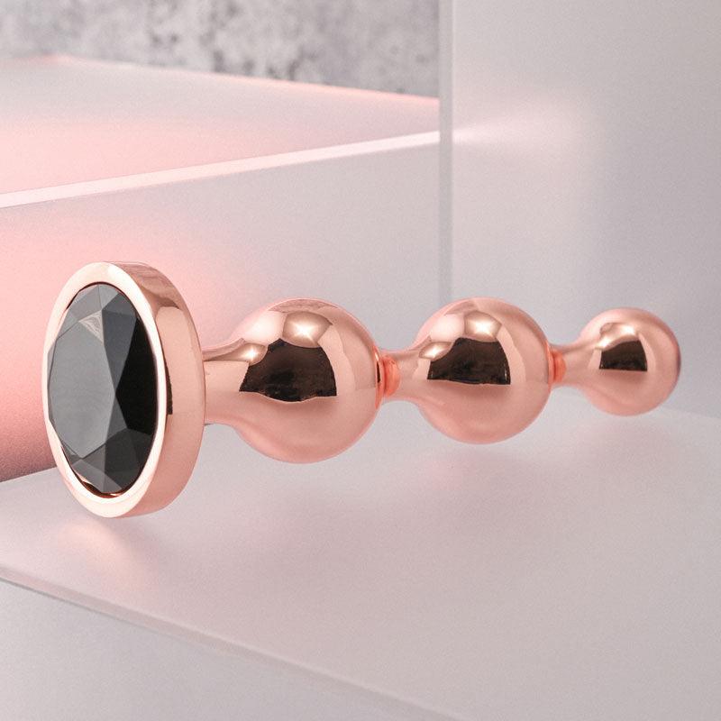 Gender X GOLD DIGGER Large - Rose Gold Large Butt Plug with Black Gem Base - GX-BP-9147-2